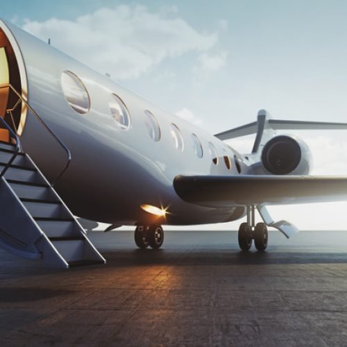 Closeup,View,Of,Business,Jet,Airplane,Parked,At,Outside,And